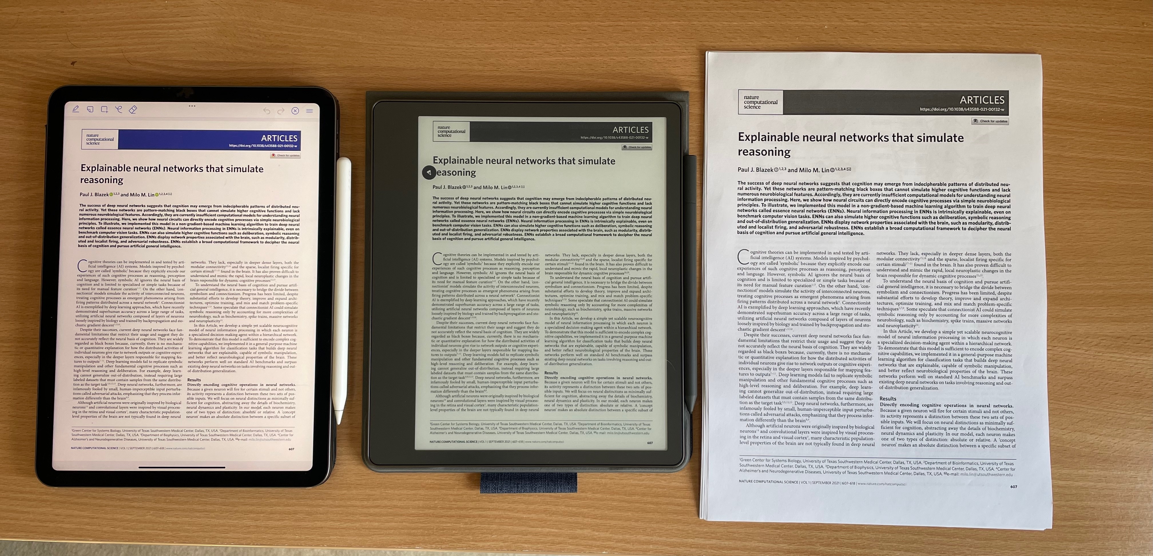 The same academic two column paper on three devices. Left to right they are: an iPad Air using Zotoro to show a PDF; the Kindle Scribe; an A4 piece of paper.